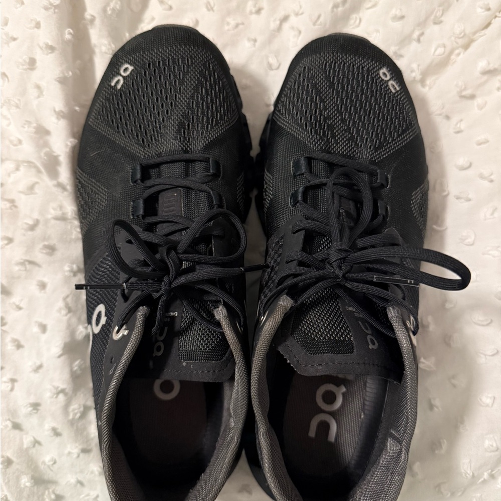 On cloud black running shoes